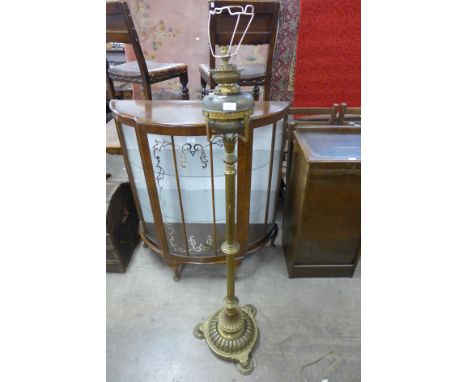 A Victorian Aesthetic Movement brass standard lamp