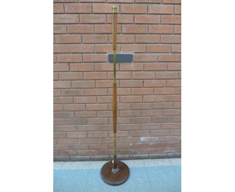 A teak standard lamp