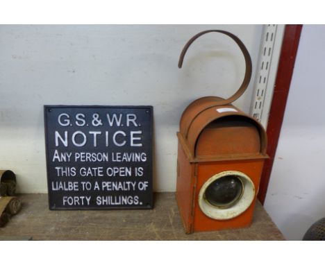 A reproduction cast iron sign and a warning lamp