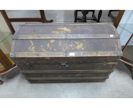 A dome topped steamer trunk