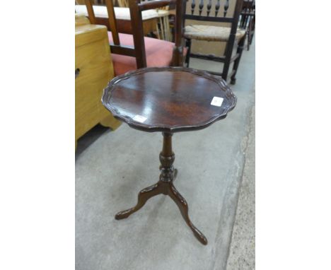 A mahogany tripod wine table