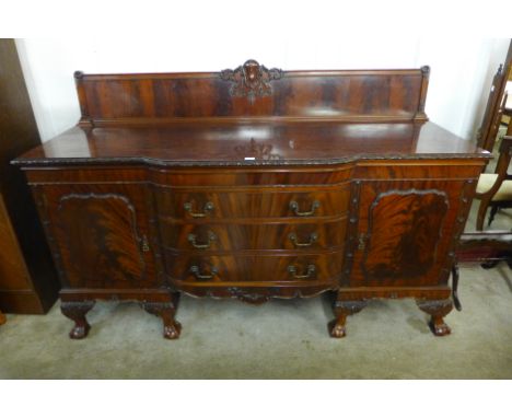 An Edward VII Chippendale Revival carved mahogany sideboard