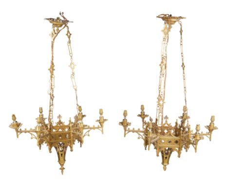A set of four Victorian gilt-bronze six-light chandeliers, of Gothic style, late 19th century, each of hexagonal form with pi