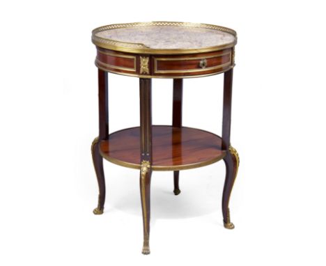 A French brass mounted mahogany circular occasional table, in the manner of Francois Linke, of Louis XVI style, first quarter