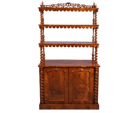 A Victorian walnut waterfall bookcase cabinet, last quarter 19th century, the fretwork top above three tiers with turned fini