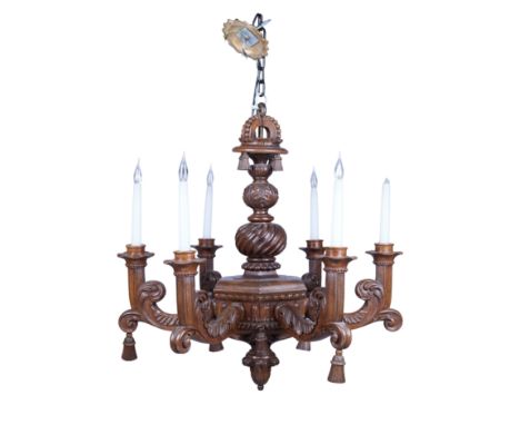 A pair of Edwardian oak six-light chandeliers, of Baroque style, early 20th century, probably supplied by Lenygon & Co., the 