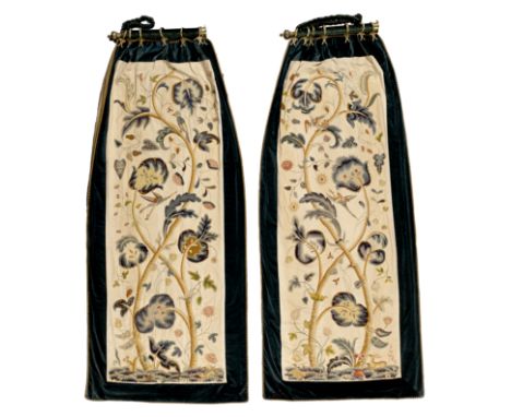 A pair of crewelwork panel curtains, 20th century, each worked in coloured wools depicting branches, leaves, flowers, animals