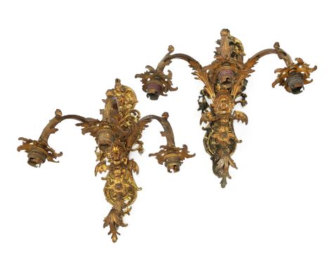 A pair of Victorian gilt-bronze three-light wall appliques, late 19th century, each backplate with scrolling foliate and flor