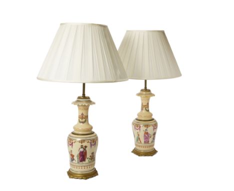 A pair of gilt-bronze mounted Limoges porcelain pale apricot ground vase lamps, late 19th century, the porcelain probably Hen