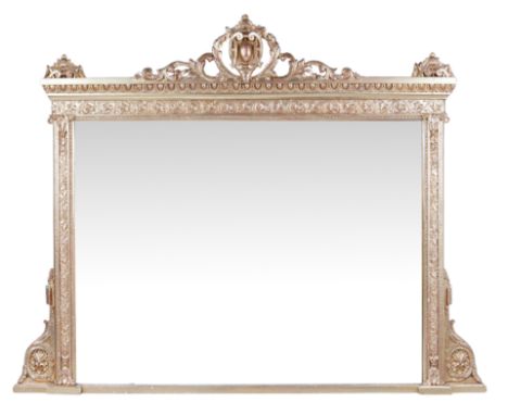 A French giltwood overmantel mirror, of Louis XVI, first quarter 20th century, with scrolling crest above rectangular plate, 