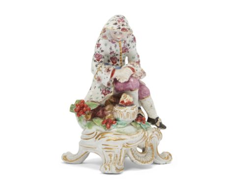 A Bow porcelain figure emblematic of winter, c.1765-70, red anchor and dagger marks to verso, the hooded figure seated on a t
