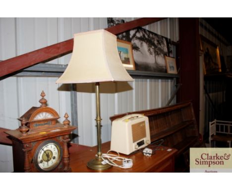 A brass table oil lamp with shade