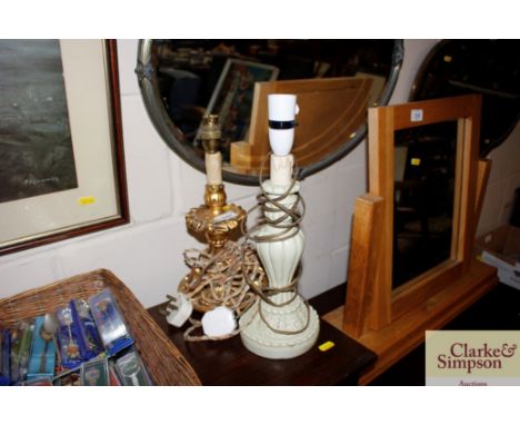 A gilt table lamp and a cream painted table lamp