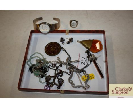 A tray of various costume jewellery to include a silver ring and matching bangle, pendants etc.