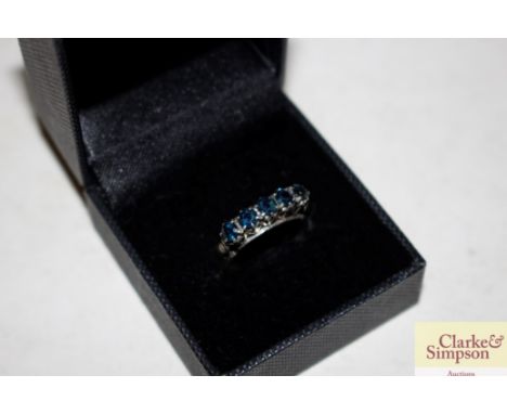 A five stone sapphire ring stamped 18k size NO