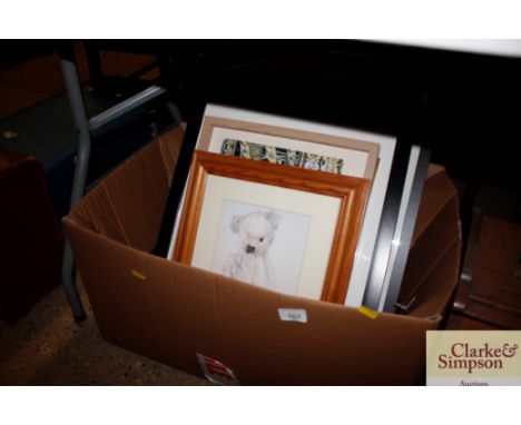 A box of miscellaneous pictures prints and frames