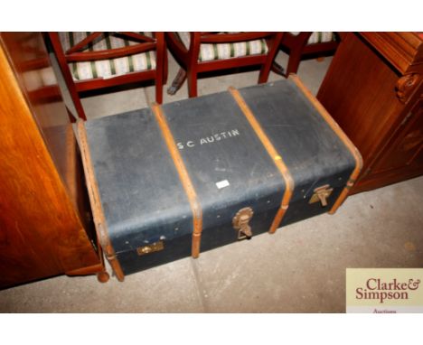 A canvas and battened vintage travelling trunk, inscribed S C Austin