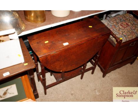 An oak gate leg occasional table