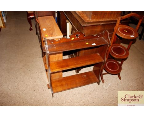An oak open fronted hanging book shelf