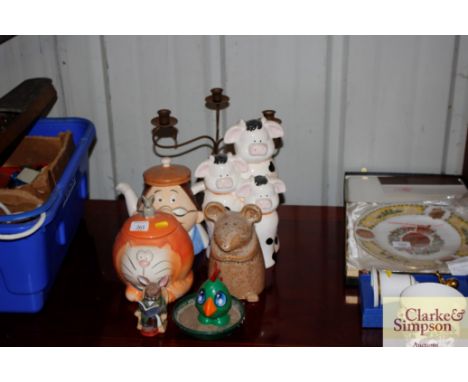 A novelty teapot; biscuit barrel; various other ceramic items and a candle holder