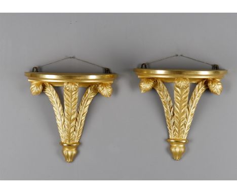 
	
		A pair of carved giltwood "Prince of Wales" feather wall brackets, 20th century incorporating some period elements, 36.5