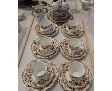 Edwardian tea service of thirty pieces with gilt and floral decoration, signs of use and wear throughout. Not available for i