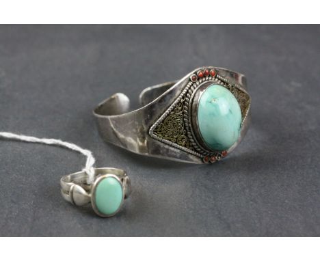 Navajo Silver Torque Bangle set with a Large Cabochon Turquoise Stone and Eight Small Carnelian Stones together with a Navajo