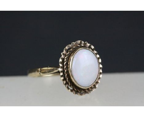 9ct Gold Ring set with an Oval Opal, 11mms x 8mms