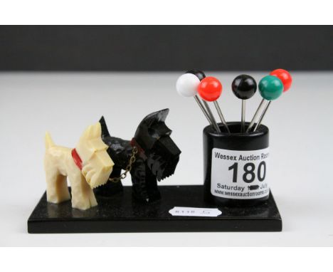 Art Deco Cocktail Stick Holder with a Black and a White Scottie Dog, the holder with Six Cocktail Sticks with Ball Finials