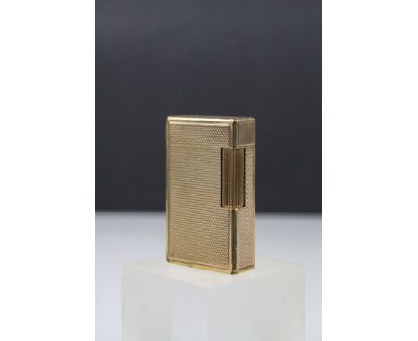 S T Dupont Gold Plated Lighter with engine turned decoration, 6cms high