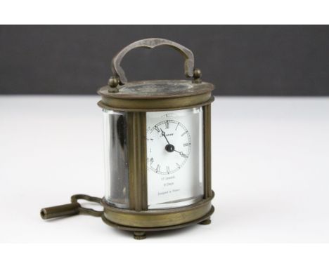 Small French ' Forum ' Oval Brass and Bevelled Glass Cased Carriage Clock, 17 Jewels and 8 day movement, with keys, 8cms high
