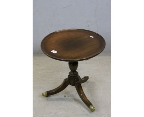 George III Style Mahogany Lamp Table with circular tray top raised on a pedestal base with three splay legs terminating in br