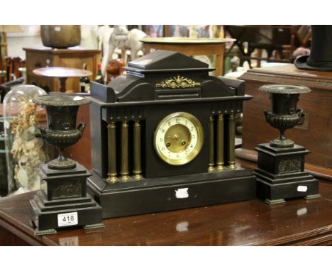 Victorian Slate Mantle Clock of Architectural Form, 38cms wide x 34cms high together with a Pair of Black Slate Campania Urns