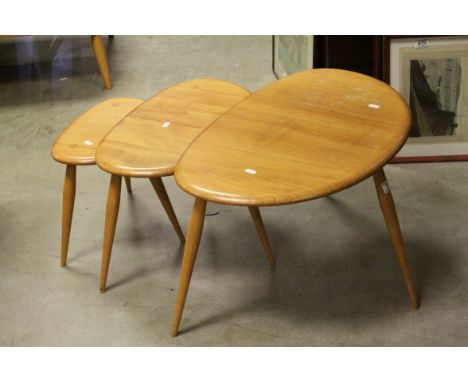 Ercol Blonde Elm and Beech Nest of Three Pebble Tables, largest 66cms long x 41cms high
