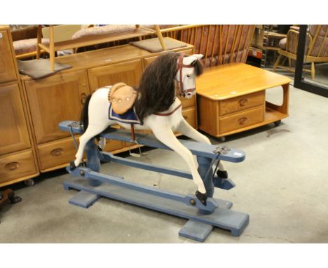 Painted Wooden Rocking Horse with Bridle and Saddle plus Horse Hair Mane and Tail, raised on a Painted Blue Trestle Base, app