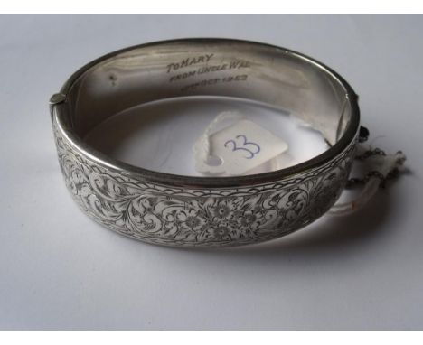 A wide foliate engraved silver bangle 23g