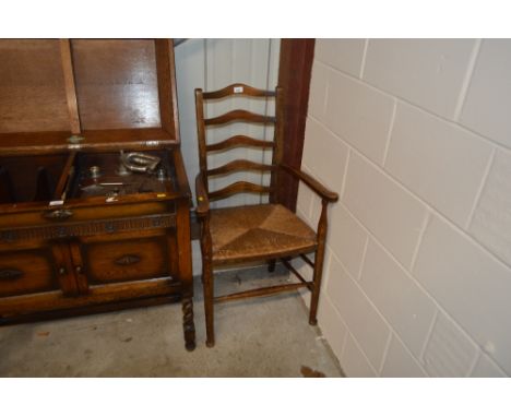A ladder back and a rush seated elbow chair