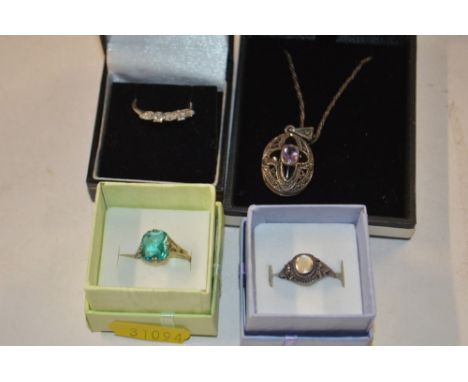 A silver dress ring set with a turquoise coloured stone; a 925 silver ring set with 5 white stones, one other 925 silver ring