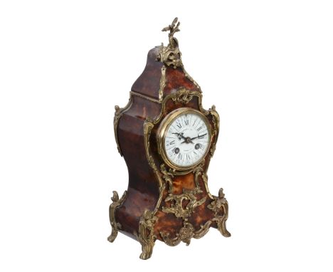 Ω  A French gilt brass mounted tortoiseshell veneered mantel clock in the Louis XV taste, retailed by Harrods Limited, London