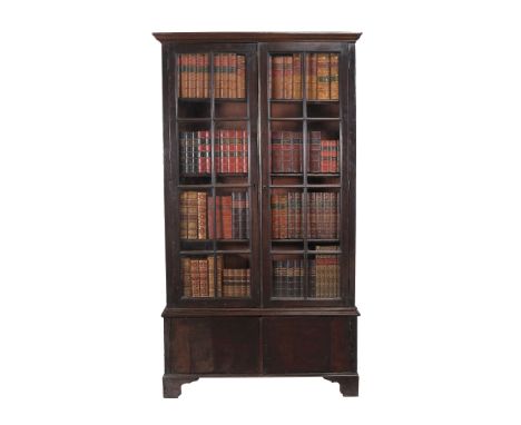  A mahogany cabinet bookcase,   circa 1750 and later, the moulded cornice above a pair of astragal glazed doors opening to ad