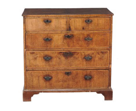  A George II walnut chest of drawers  , circa 1740, with two short and three long graduated drawers, on shaped bracket feet, 