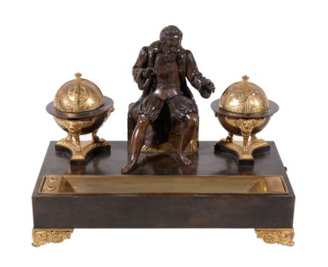  A Continental gilt and patinated bronze  encrier,   mid 19th century, surmounted by a seated figure probably of Galileo, fla