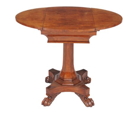  A George IV kingwood games table  , circa 1825, the oval top with sliding section revealing a tooled leather inset backgammo