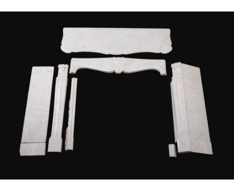  A Victorian carved white marble chimneypiece in Louis XV taste,   late 19th century, the loosely rectangular mantel with ser