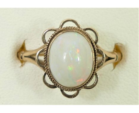 A 9ct gold opal dress ring, 10 x 8mm, Q, 3.2gm