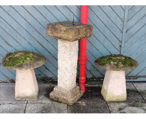 A pair of reconstituted stone two piece mushrooms, diameter 47cm and a sundial, 85cm (3) 