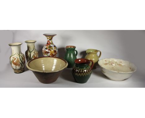 A Welsh Ewenny studio pottery cider jug, together with a pair of ceramic flower vases, a Devonshire art pottery jug, a glazed