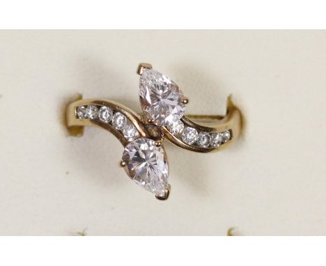 A 9ct gold and CZ crossover ring, N, 3.2gm 