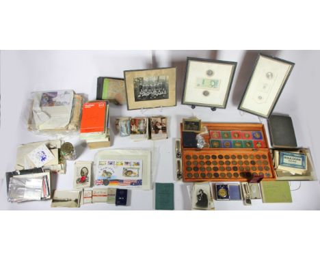 A collection of collectables, to include early 20th Century postcards, loose stamps, cigarette/tea cards, pin badges, coinage