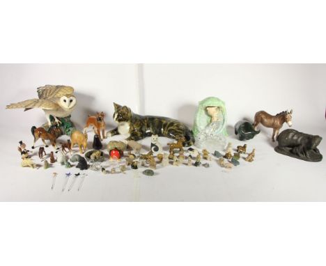 A ceramic model of a seated cat by Mike Hinton, signed. Together with a Sylvac figural wall planter, a model of a barn owl by